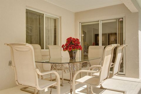 Enjoy dining out on the Lanai, overlooking the pool.