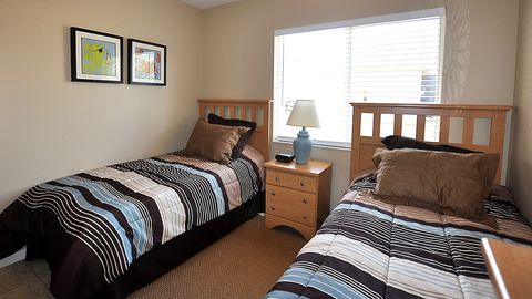 The fourth bedroom features two twin beds.