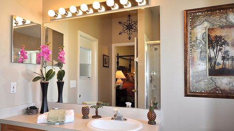 The master bath off the master bedroom has direct access out to the lanai. Jump out of the pool and right into the shower to warm up and rinse off.