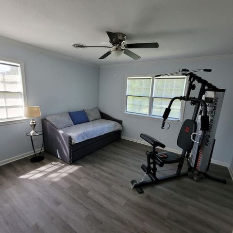 Bedroom 3 with trundle bed pull out and gym equipment. To include workout mats, light weights, pushup equipment.