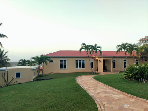 Villa entrance with studio cottage on the side