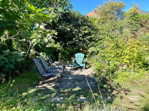 Shared Back yard garden with  sitting area.