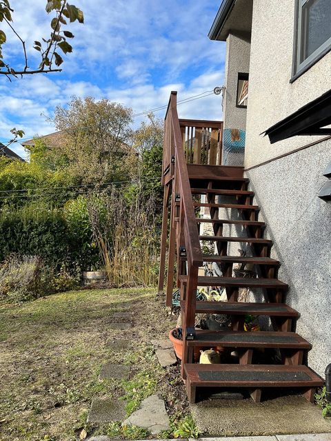 Back Stairs that lead to the back porch and kitchen entrance.