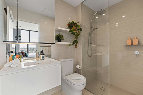 Refresh in the sleek modern ensuite featuring a walk-in rainfall shower and contemporary finishes.
