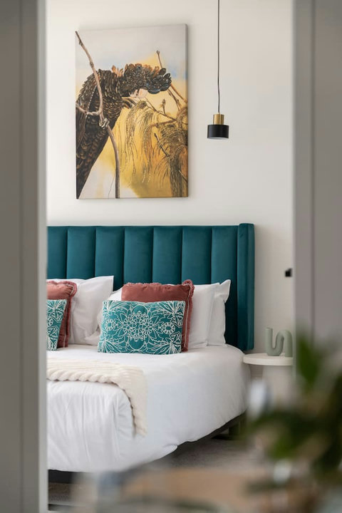 Designer touches and plush furnishings create a warm and inviting master retreat.
