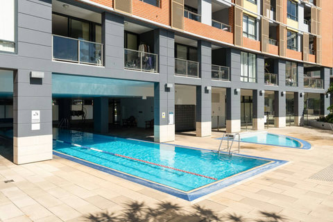 Cool off in the sparkling outdoor pool, an ideal spot to relax and unwind during your stay.