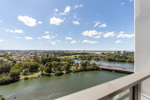Enjoy sweeping views across the river, parklands, and Sydney skyline from your elevated private balcony.