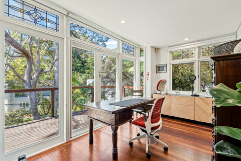 A bright, character-filled workspace surrounded by leafy Mosman views