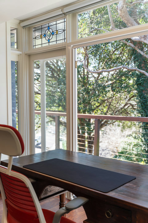 Natural light, timber floors and treetop views make this a calm and inviting place to work or unwind