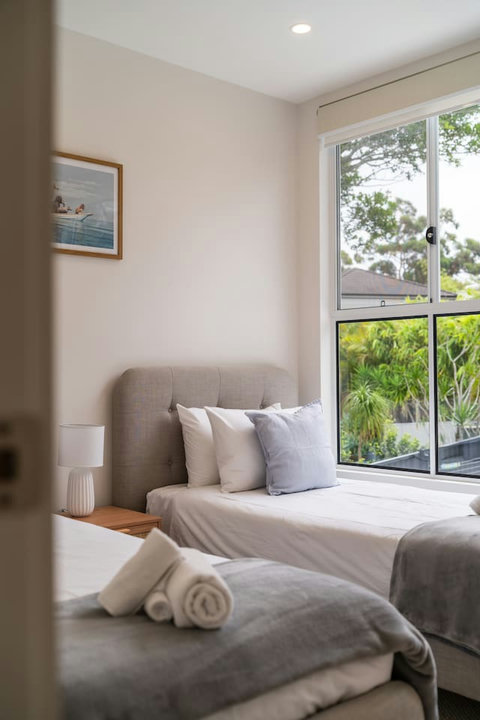 Thoughtfully styled with quality bedding and coastal-inspired touches throughout.