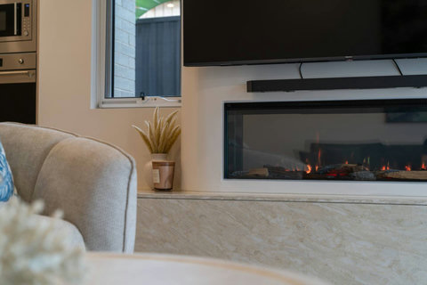Cosy up beside the feature fireplace after a day at the beach or exploring Cronulla.