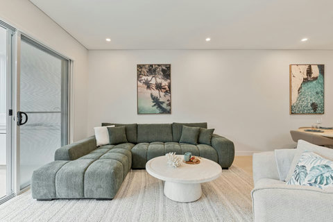 Sink into the oversized lounge and enjoy relaxed family living in light-filled comfort.