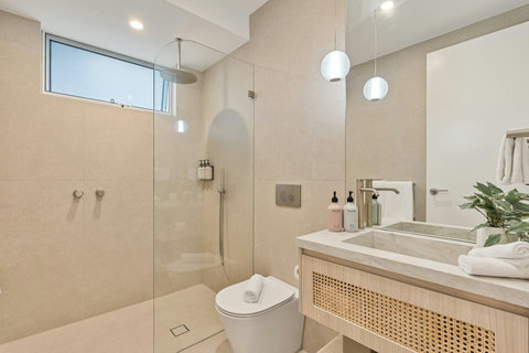 Stylish family bathroom featuring a bathtub, walk-in shower and premium finishes.