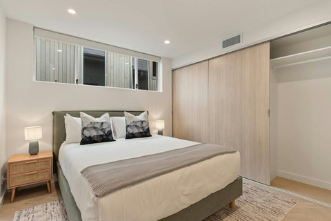 Thoughtfully styled with quality bedding and coastal-inspired touches throughout.