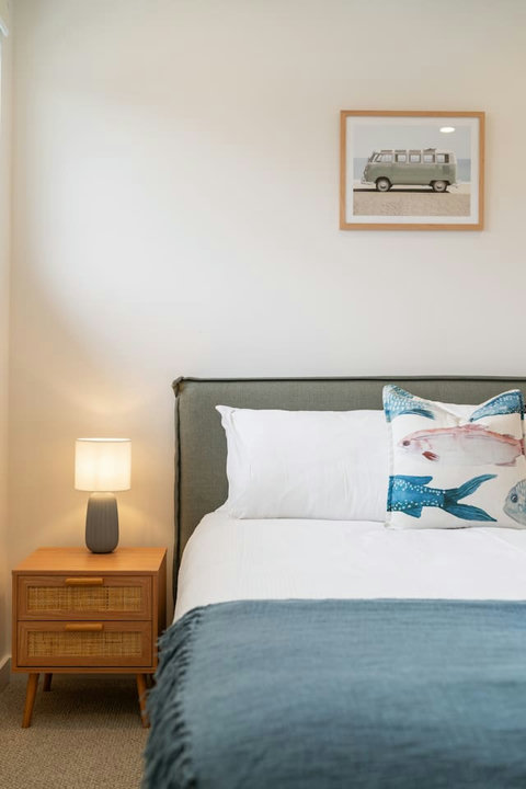 Thoughtfully styled with quality bedding and coastal-inspired touches throughout.