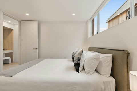 Thoughtfully styled with quality bedding and coastal-inspired touches throughout.