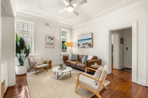 Enjoy a quiet evening in with comfortable seating and thoughtful living-room details