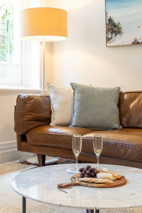 Settle into the comfortable lounge nook with soft furnishings and relaxed coastal styling