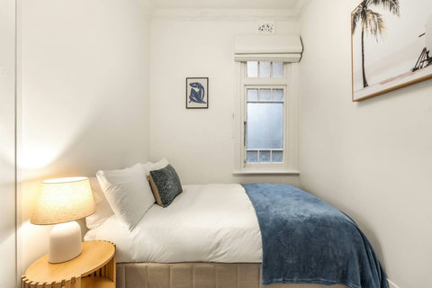 Bedroom | Fresh linens, coastal-inspired styling and generous proportions create a restful retreat