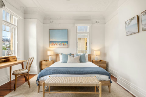 Natural light and calming tones give the bedroom a bright and welcoming feel