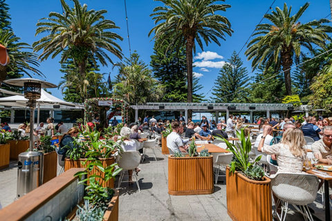 Enjoy casual alfresco dining surrounded by greenery at a charming local café