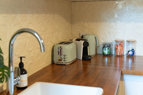 Morning coffee and everyday essentials are conveniently arranged within the kitchen