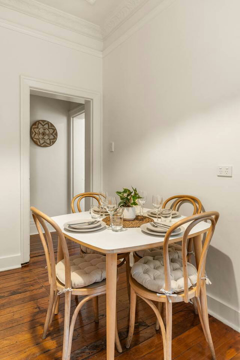 Gather around the dining table for shared meals with the bright kitchen conveniently close by