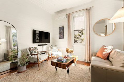 Bright and welcoming living area with original timber character