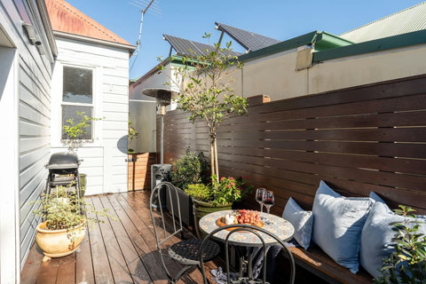 Sunny rear deck with BBQ and outdoor seating