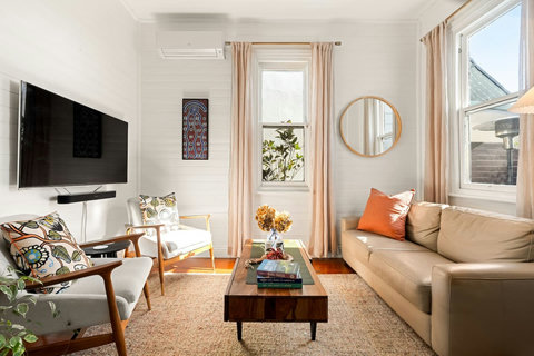 Comfortable lounge with TV, air-conditioning, and natural light