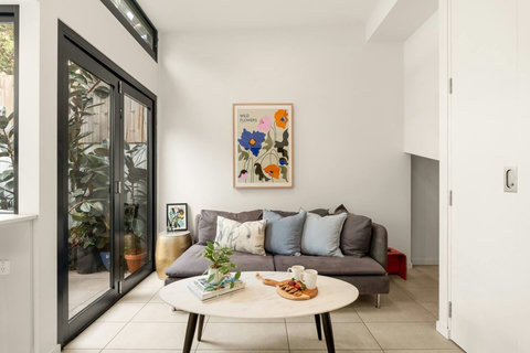Thoughtful artwork, soft furnishings and leafy touches create a relaxed place to unwind.