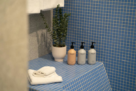 Fresh towels and guest toiletries are neatly prepared for your arrival.