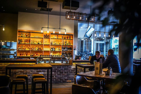 Enjoy an evening drink in the warm, atmospheric setting of a nearby bar.