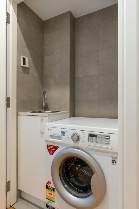 Laundry | A washing machine and utility sink make longer stays more convenient.