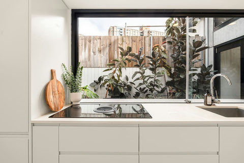 Kitchen | Cook with ease using the modern stovetop, sink and generous preparation space.