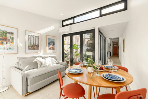 The dining area sits just beyond the kitchen, creating an easy flow for shared meals.