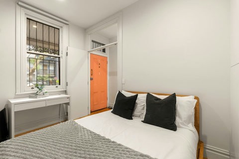 Rest comfortably in the bedroom, complete with a desk and original character details.
