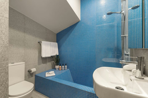 Shower or soak in the compact bathroom, thoughtfully designed to make excellent use of the space.