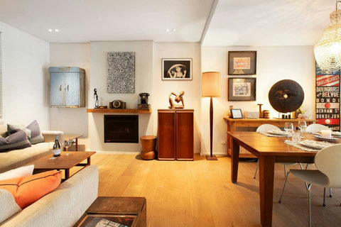 Comfortable living and dining spaces come together in a stylish interior designed for relaxed stays