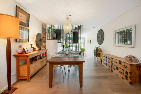Spacious open-plan dining area with character furnishings and an easy flow towards the rear of the home