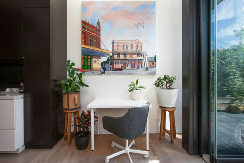 Dedicated workspace positioned beside the kitchen, ideal for catching up on work during your stay