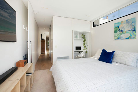 Bright bedroom with built-in storage and easy access to the rest of the home
