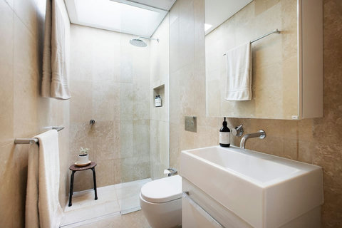 Modern bathroom with walk-in shower, neutral finishes and a clean contemporary design