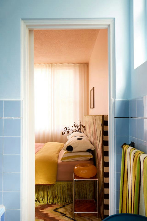 From the bathroom to the bedroom, the apartment’s bold colour palette gives every space its own sense of style