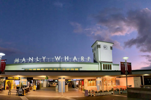 Manly Wharf at dusk, a well-known local landmark with ferries, dining and shops close by