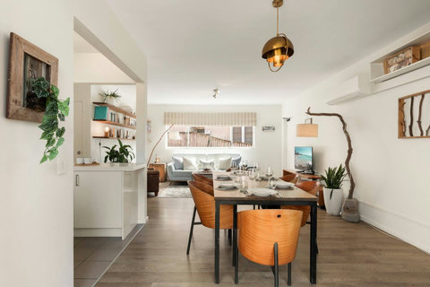 Comfortable dining space flowing into the open-plan living area, ideal for relaxed meals at home
