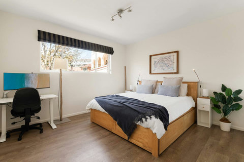 Bedroom 1 | A dedicated workspace beside the king bedroom makes it easy to stay productive while away