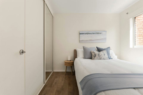 Bedroom 2 | Unwind in a peaceful queen bedroom styled in soft, calming tones