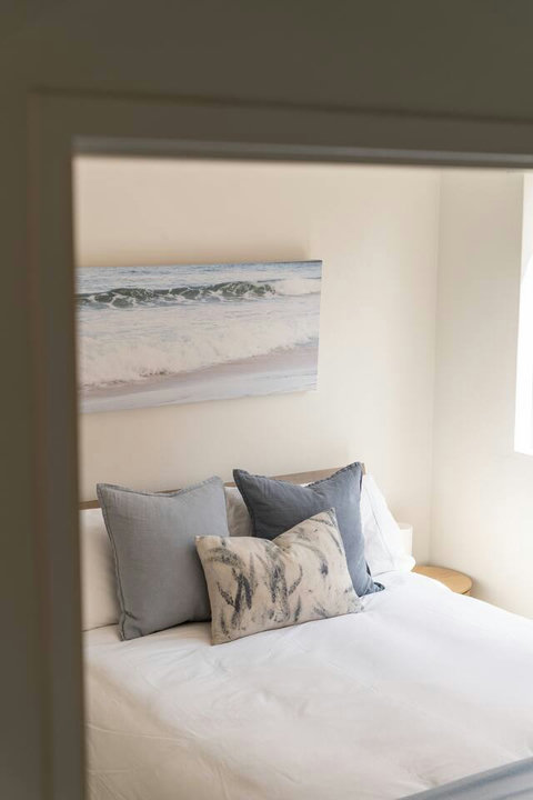 Simple, restful styling creates an easy space to relax at the end of the day