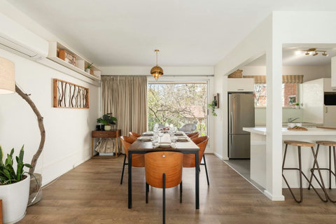 Bright open-plan dining space positioned beside the kitchen for easy everyday meals